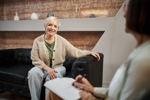 A live-in carer helping a client with her diary.
