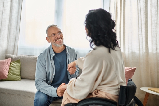 A male live-in carer caring for a Multiple Sclerosis patient.