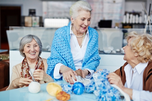 Three elderly woman laughing