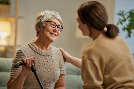 A lady talking to a live-in nurse.