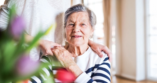 An elderly woman with her daughter