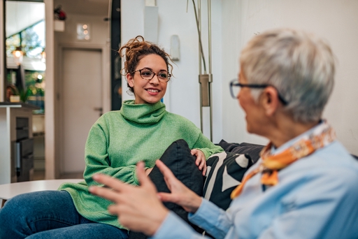 A mother and daughter speak at home