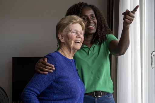 A woman with parkinsons being looked after by a live-in carer.